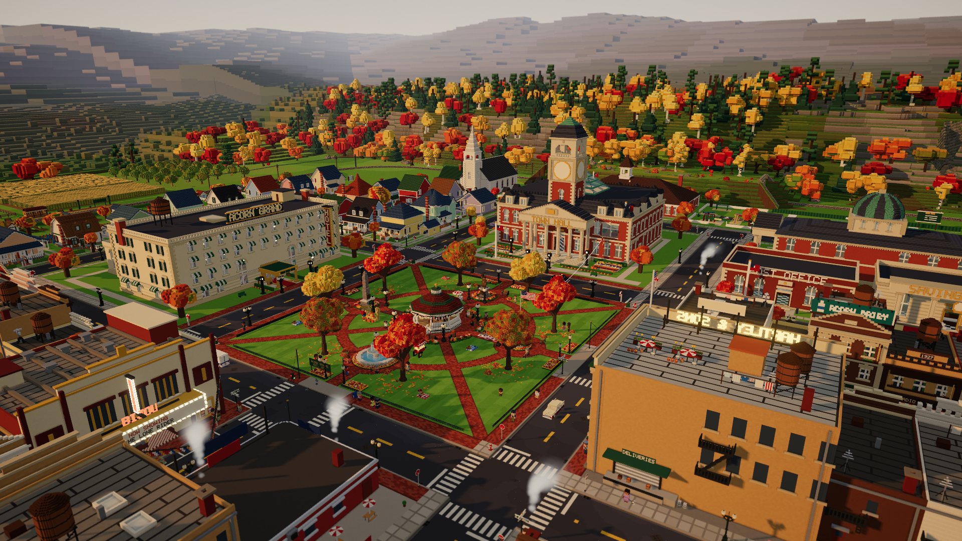 Acorn Square from above at golden hour, with the bandstand, the Town Hall clock tower, the Acorn Grand Hotel and autumn trees