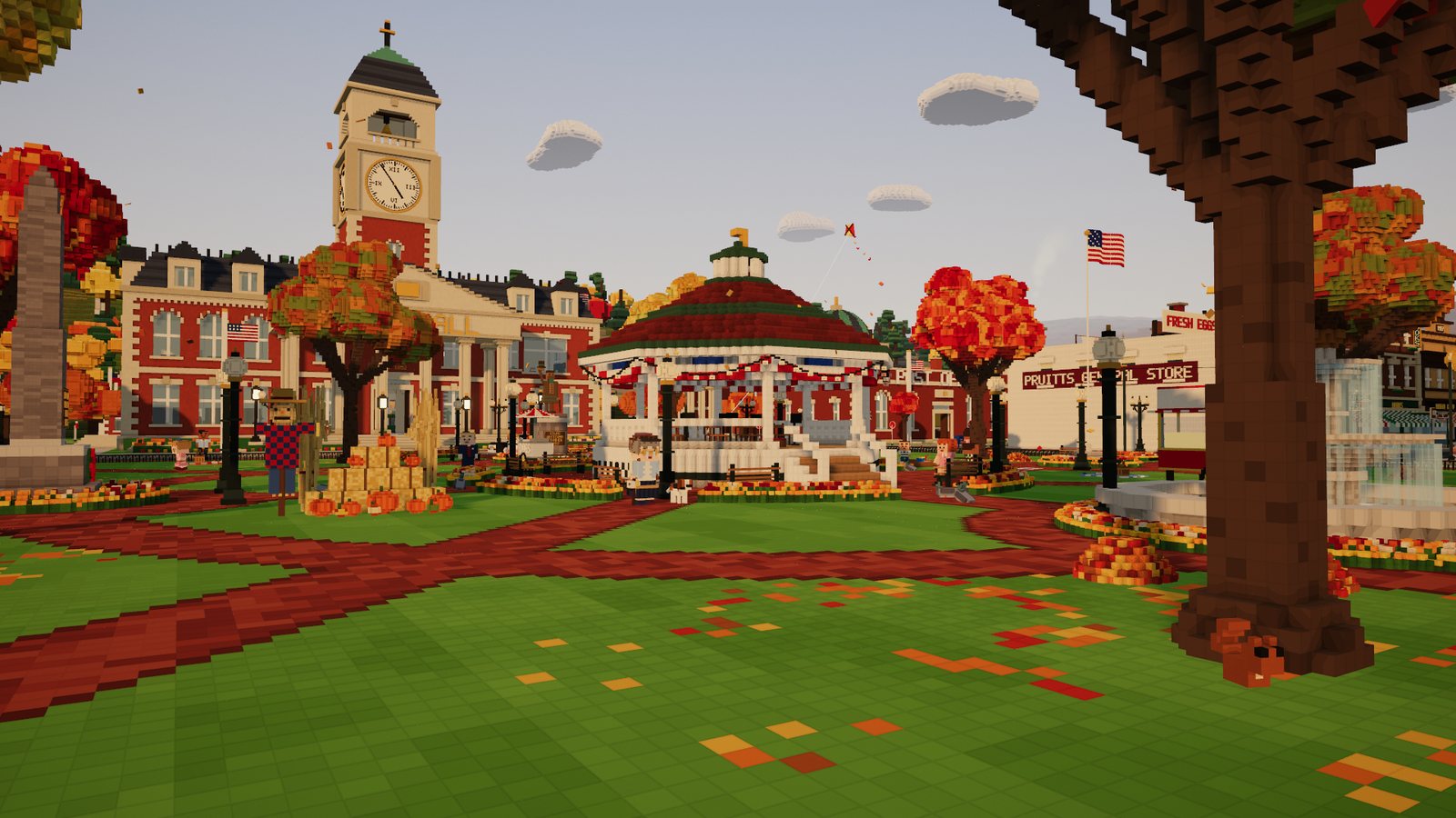 Acorn Square with the bandstand, the Town Hall clock tower, flower beds and a leaf-strewn lawn