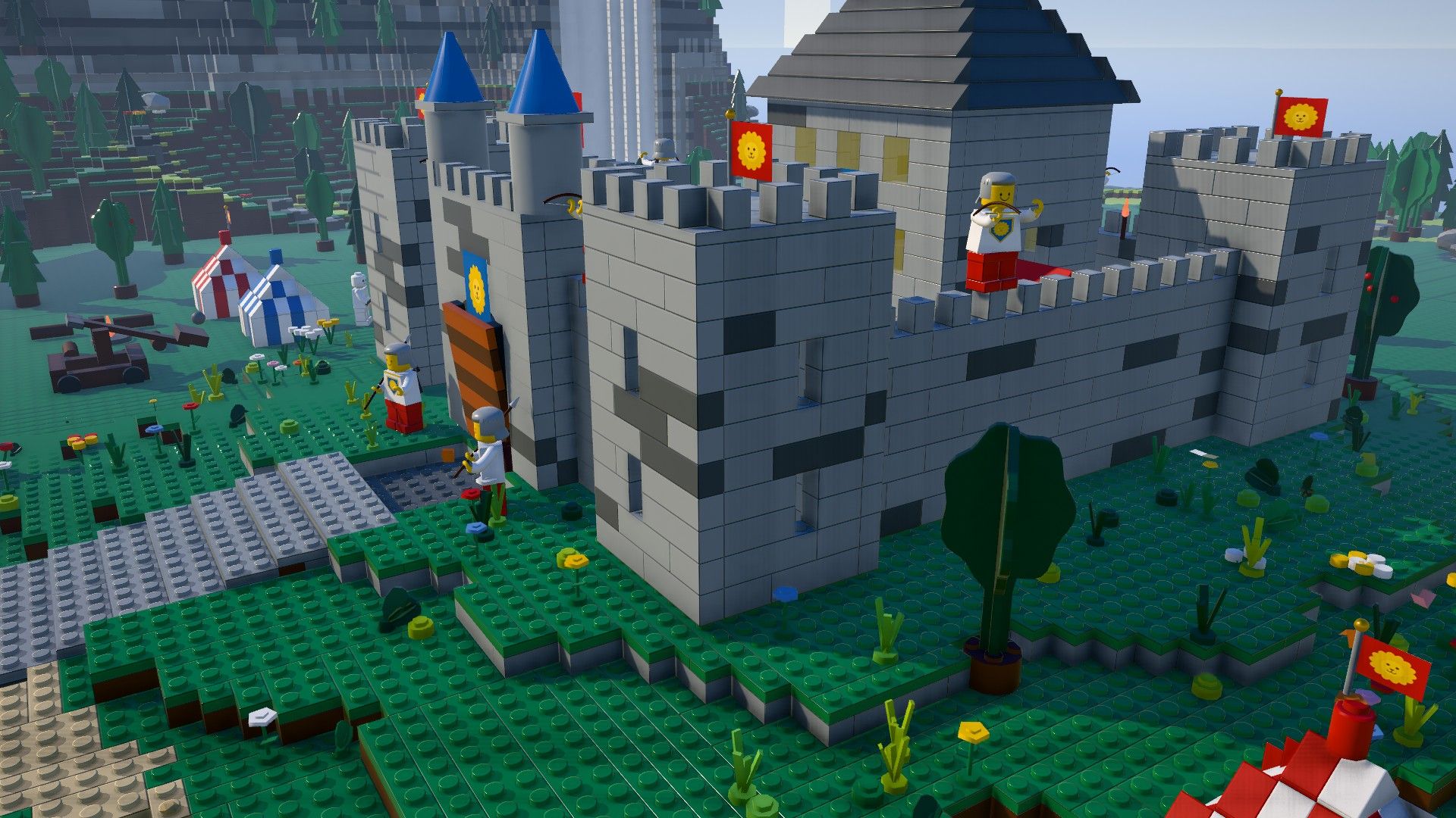 A grey brick castle with blue and yellow flags, knights on the walls and striped tournament tents below
