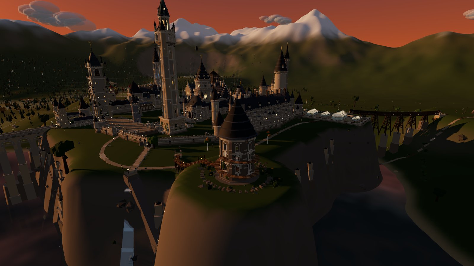 The Owlery tower on a grassy crag, with the castle behind it