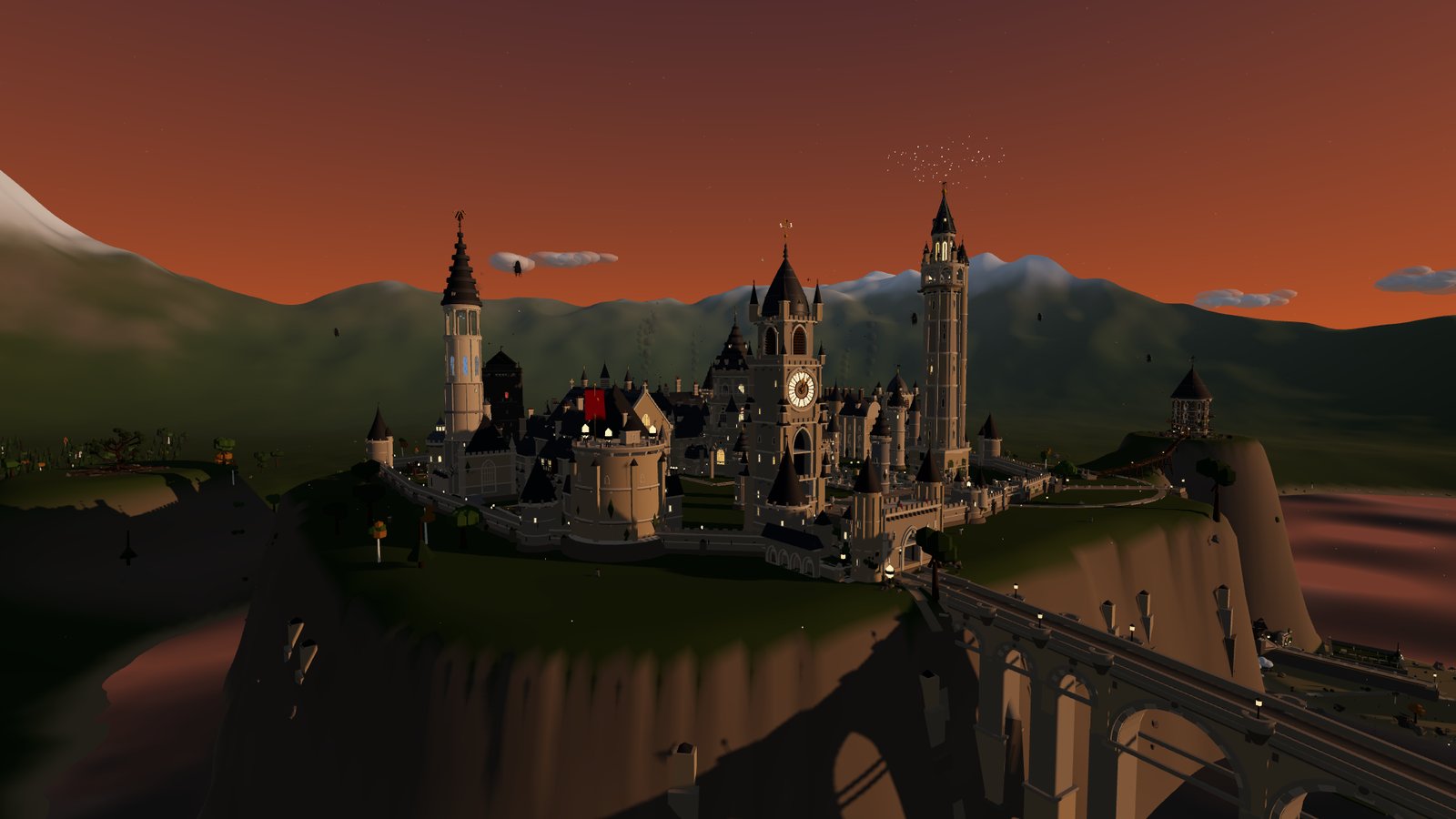 The castle at dawn under a warm pink and orange sky