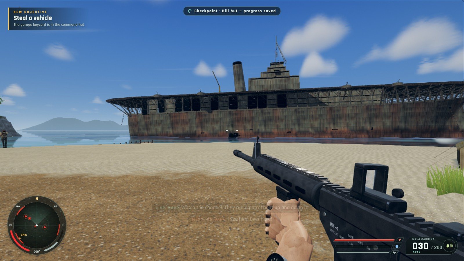 The carrier wreck seen from the beach of Wreck Bay, carbine in hand